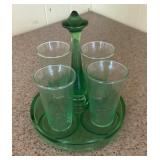 Four depression, glass tumblers, and tray
