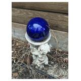 Angel holding gazing ball