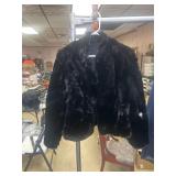 Small fur coat with small spot, damage on left arm