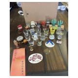 Several shot glasses and souvenirs