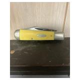 Case xx pocket knife with yellow case