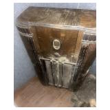 Early floor model radio in rough condition