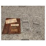 2 metal sleighs and sign