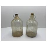 Clear Gallon Jugs One is Marked Duraglas