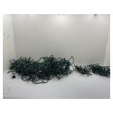 Strands of Green-Wired Clear Christmas Lights