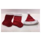 Red and White Christmas Stockings and a Santa Hat