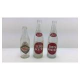 Two Big Red Soda Pop 12 Ounce Bottles and One