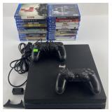 PS4 with 2 controllers, cords and 22 games,