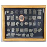 Framed Indianapolis 500 pit badges, 38 total, as
