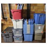 Group of plastic storage totes, most with lids