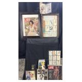 Group of framed vintage magazines, pin up cards