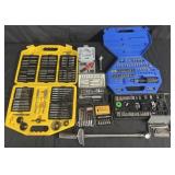 Group of hand tools: drill bits, socket sets,