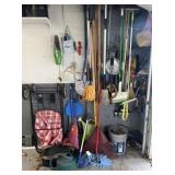 Contents of garage wall and floor: cart, hand