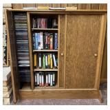 Entertainment cabinet filled with cd's, VCR tapes