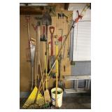 Collection of garden tools, axes, maul, pic,