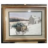 Framed print depicting snowy cottage with cart &