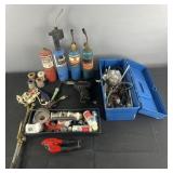 Group of soldering irons, plumbing supplies,