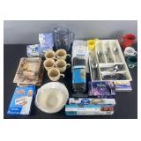 Group of kitchenware, shower curtains, bathtub