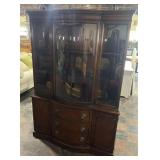 One piece curio cabinet with 2 upper shelves, 3