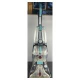 Hoover Power Scrub Elite carpet cleaner, turns on