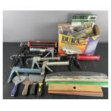 Group of cull guns, sand paper and painting