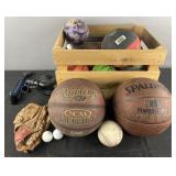 Group of sporting equipment, basketballs, golf
