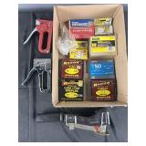 3 staplers and a variety of stables