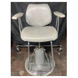 Adjustable height barberï¿½s chair, 1/4ï¿½ tear on
