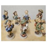 Hummel porcelain figurines. 7 figures: traveler,