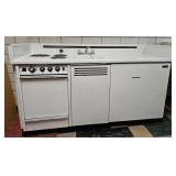 Dwyer Enameled oven, sink, counter, refrigerator.