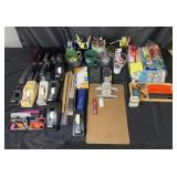 Group of office supplies: staplers, box knives,