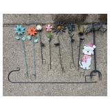 Group of yard decorations, hose reel and shepards