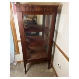 Antique curio cabinet with locking glass door