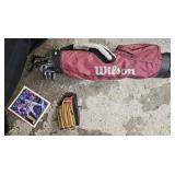 Wilson golf bag w/ clubs: putters mainly.
