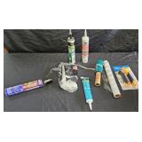 Caulk, plastic wrap and plastic drop cloths and