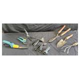 Garden snips, hand shovel and rake, garden hose