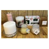 Group of new and used candles, gift set and more