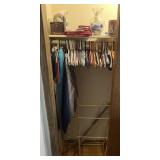 Contents of bedroom closet, basket, books, vase,