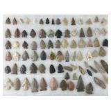 Collection of Native American arrowheads and bird