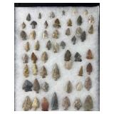 Collection of Native American arrowheads in