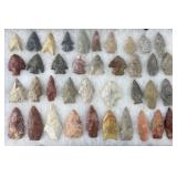 Collection of Native American arrowheads in
