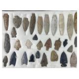 Group of Native American arrowheads and drill, in