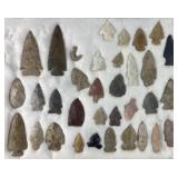 Group of Native American arrowheads and fish