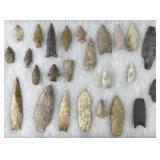 Collection of Native American arrowheads in