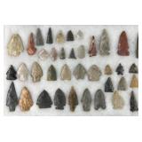 Collection of Native American arrowheads and bird