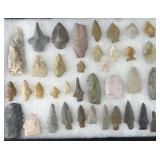 Collection of Native American arrowheads in