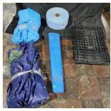 3 Tarps, rolls of foam and small animal cage
