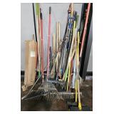 Long handled tools. Rakes, brooms, shovels, post