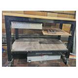 Rolling work bench w/ drawer and two shelves.