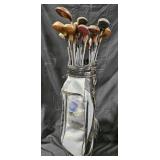 Golf bag and approximately 24 clubs. Mostly wood